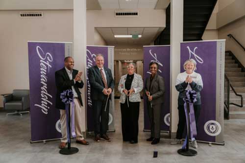 Representatives from Middle Georgia State University and Houston Healthcare at the ribbon cutting and reception for the Houston Healthcare Nursing Suite.